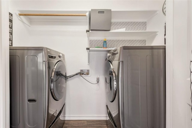 laundry area with dark hardwood / wood-style floors and hookup for a washing machine