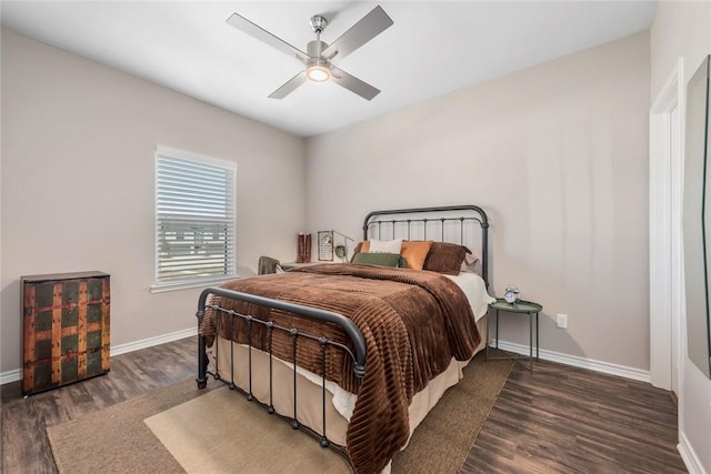 bedroom with dark wood-type flooring and ceiling fan