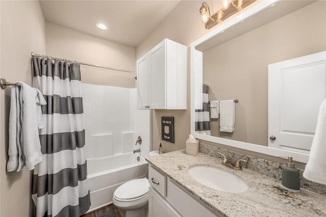 full bathroom featuring vanity, shower / bathtub combination with curtain, and toilet