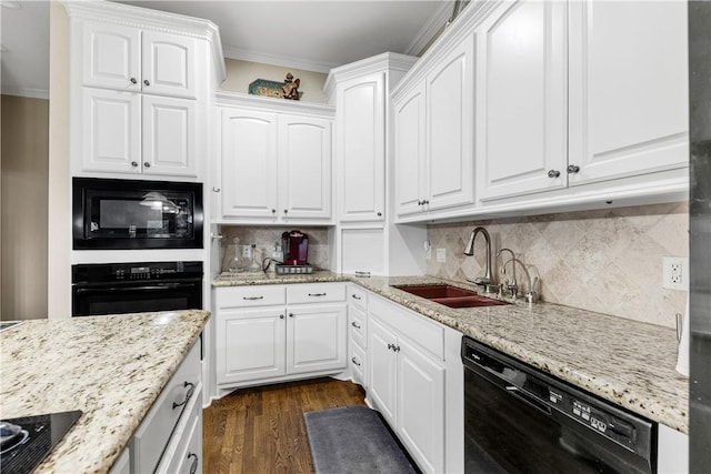 kitchen featuring sink, dark hardwood / wood-style flooring, crown molding, white cabinets, and black appliances