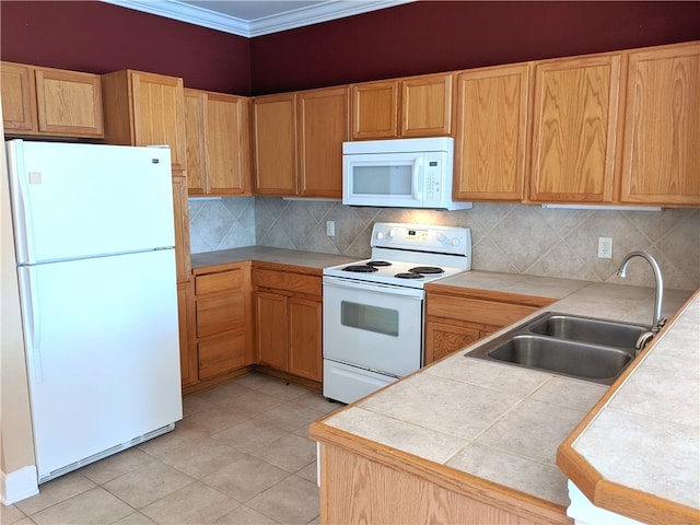 kitchen featuring tile countertops, backsplash, sink, and white appliances