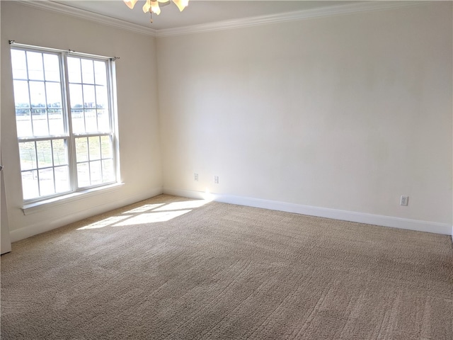 carpeted spare room with a water view, ceiling fan, and ornamental molding