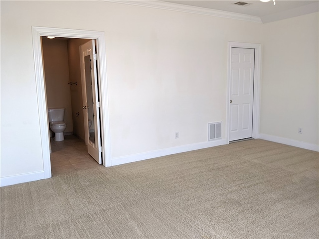 carpeted empty room featuring ornamental molding