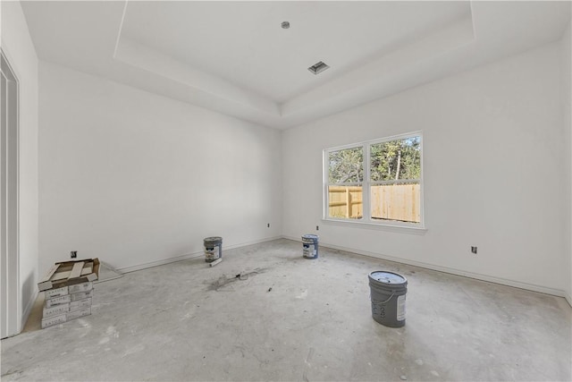 spare room featuring a tray ceiling