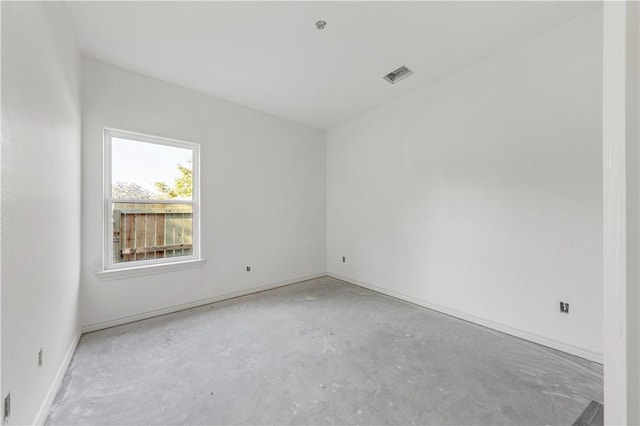 spare room with concrete flooring