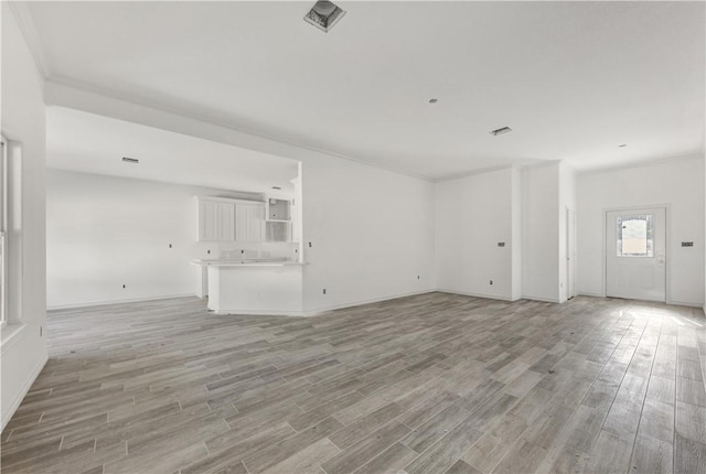 unfurnished living room with light hardwood / wood-style floors