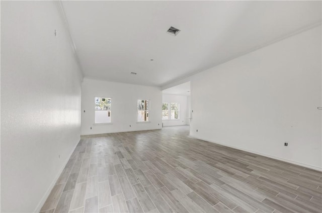 unfurnished living room with light wood-type flooring