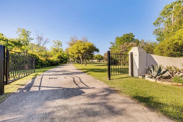 601 E Collard St, Madisonville, TX 77864 - view of street featuring a gate and a gated entry