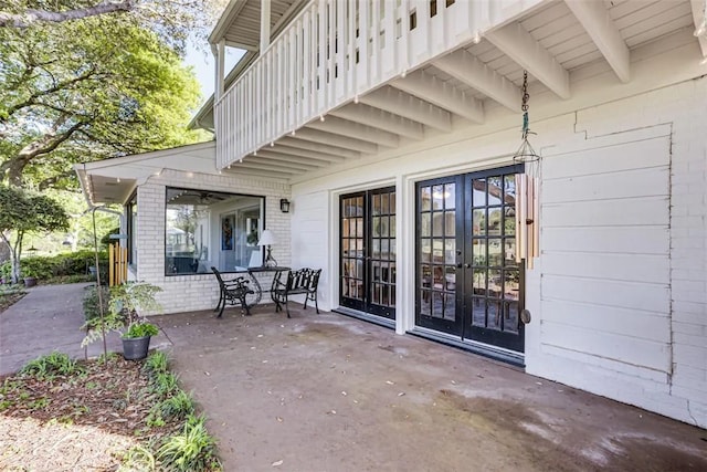 601 E Collard St, Madisonville, TX 77864 - view of patio / terrace featuring a balcony and french doors