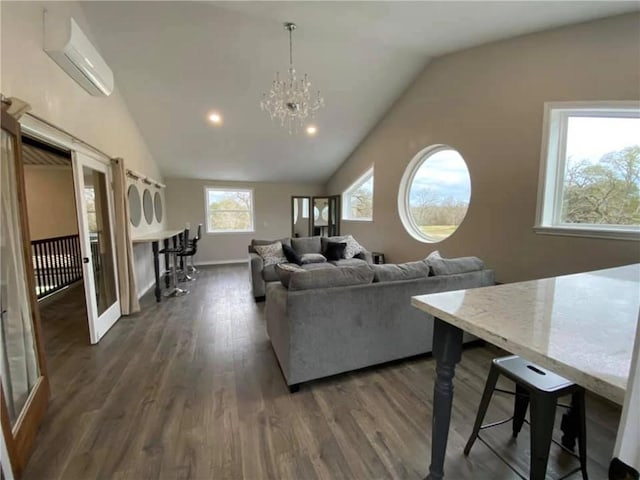 601 E Collard St, Madisonville, TX 77864 - living area featuring a wall mounted air conditioner, lofted ceiling, dark wood finished floors, a chandelier, and recessed lighting