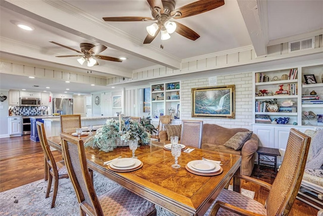 601 E Collard St, Madisonville, TX 77864 - dining room featuring beamed ceiling, dark wood-style flooring, ceiling fan, and ornamental molding