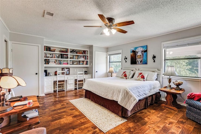 601 E Collard St, Madisonville, TX 77864 - bedroom featuring crown molding, wood finished floors, a textured ceiling, ceiling fan, and an office area