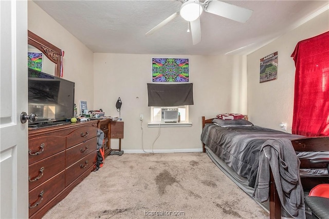 carpeted bedroom with ceiling fan and cooling unit