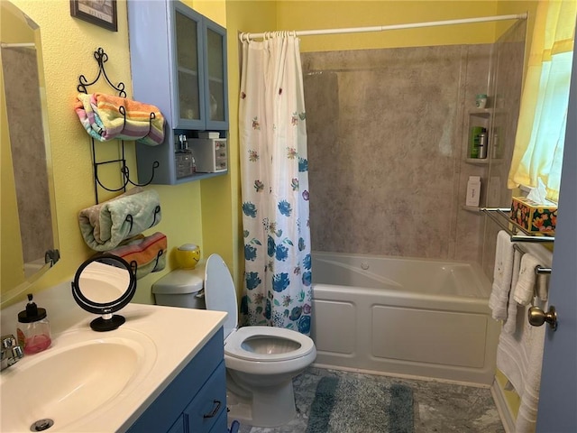 full bathroom featuring vanity, shower / tub combo, and toilet