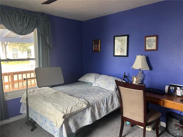 carpeted bedroom featuring a textured ceiling