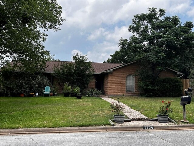 3704 Holly Dr, Bryan, TX 77802 - view of front facade featuring a front yard