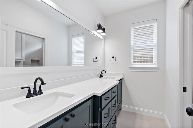 bathroom featuring tile patterned floors, a wealth of natural light, and vanity