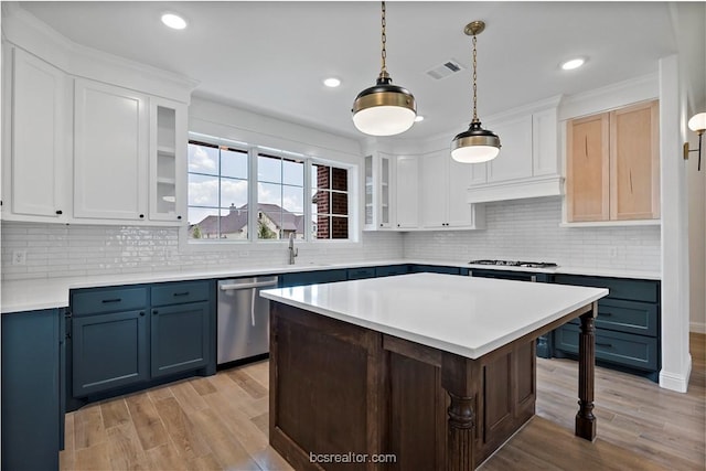 kitchen featuring white cabinetry, hanging light fixtures, light hardwood / wood-style flooring, blue cabinets, and appliances with stainless steel finishes