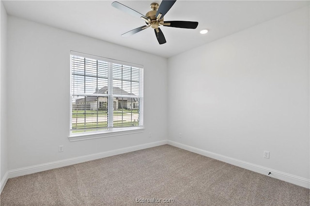 empty room featuring carpet flooring and ceiling fan