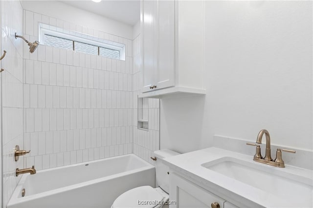 full bathroom featuring vanity, toilet, and tiled shower / bath combo