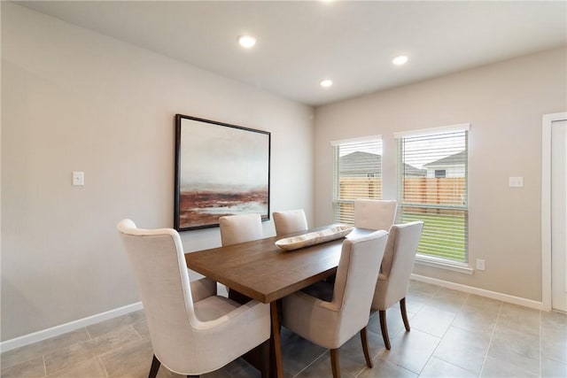 dining area with baseboards and recessed lighting