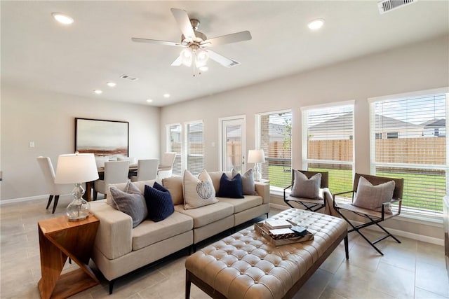 living room featuring recessed lighting, visible vents, and a healthy amount of sunlight