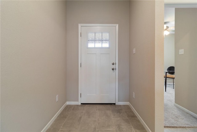 6410 Raleigh Loop, College Station, TX 77845 - doorway to outside featuring baseboards, ceiling fan, and light tile patterned floors