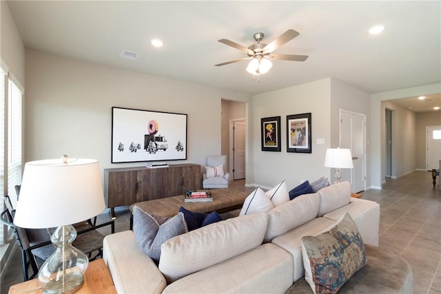 living room with ceiling fan, baseboards, visible vents, and recessed lighting