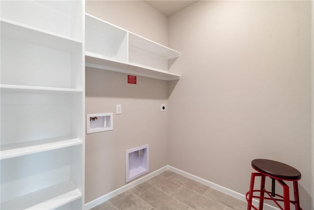 6410 Raleigh Loop, College Station, TX 77845 - washroom with electric dryer hookup, baseboards, washer hookup, and light tile patterned floors