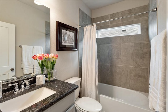 full bathroom with vanity, shower / bath combination with curtain, and toilet