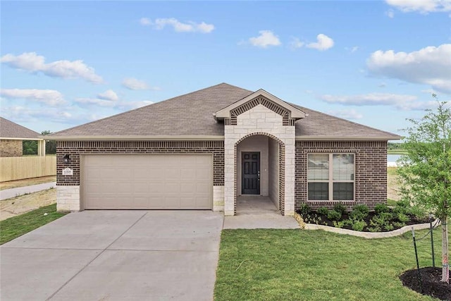 view of front of home with a front lawn, brick siding, an attached garage, and roof with shingles