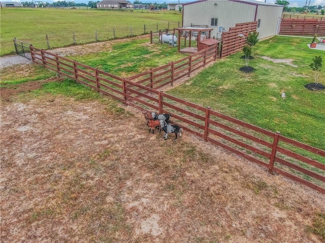 2181 Fm 166, Caldwell, TX 77836 - view of green lawn featuring an outdoor structure, a view of countryside, and an exterior structure