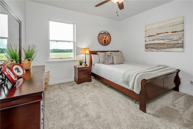 2181 Fm 166, Caldwell, TX 77836 - bedroom with carpet flooring, baseboards, and a ceiling fan