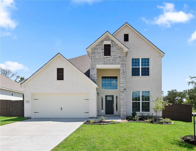 view of front facade with a front yard and a garage