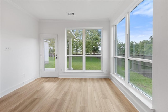 unfurnished sunroom with plenty of natural light