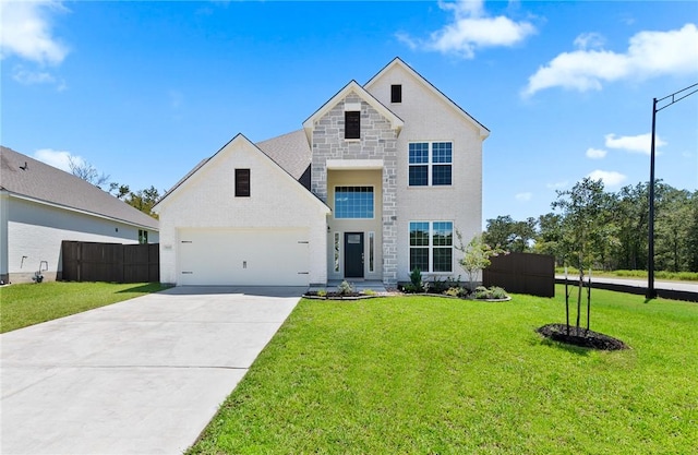 view of front of house with a garage and a front lawn