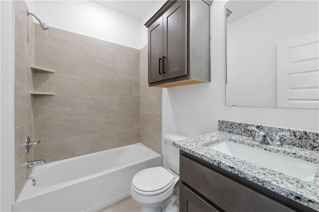 full bathroom with vanity, toilet, and tiled shower / bath