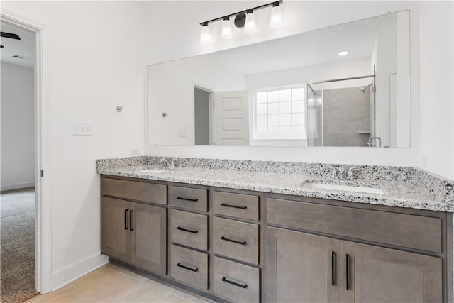 bathroom with vanity and walk in shower