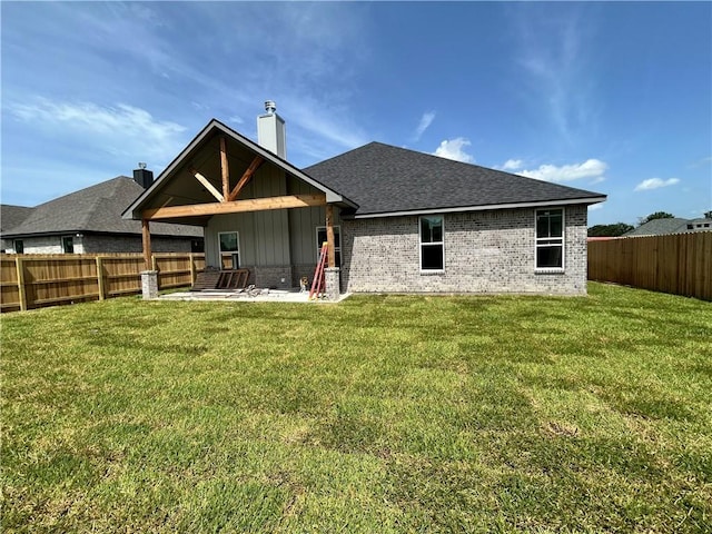 3577 Chantilly Path, Bryan, TX 77808 - rear view of property with board and batten siding, a fenced backyard, a patio, and brick siding