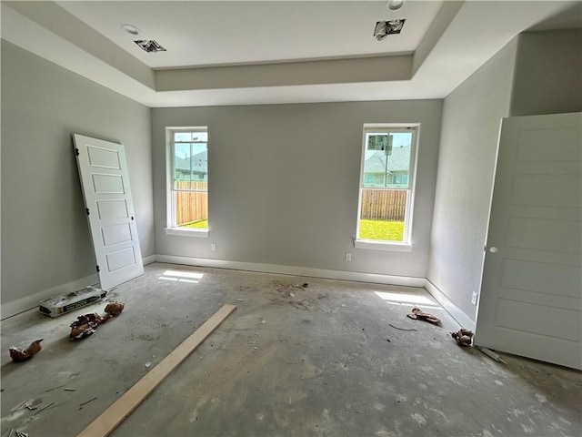 3577 Chantilly Path, Bryan, TX 77808 - unfurnished bedroom with a tray ceiling and baseboards
