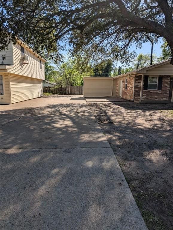 4104 Marsh St, Bryan, TX 77803 - view of yard featuring fence and concrete driveway
