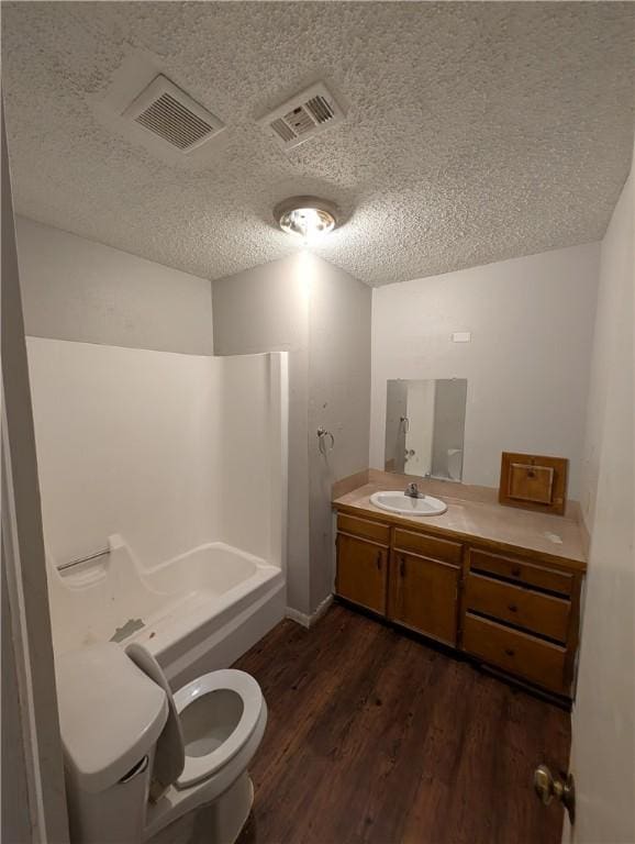 4104 Marsh St, Bryan, TX 77803 - bathroom featuring toilet, wood finished floors, vanity, and visible vents