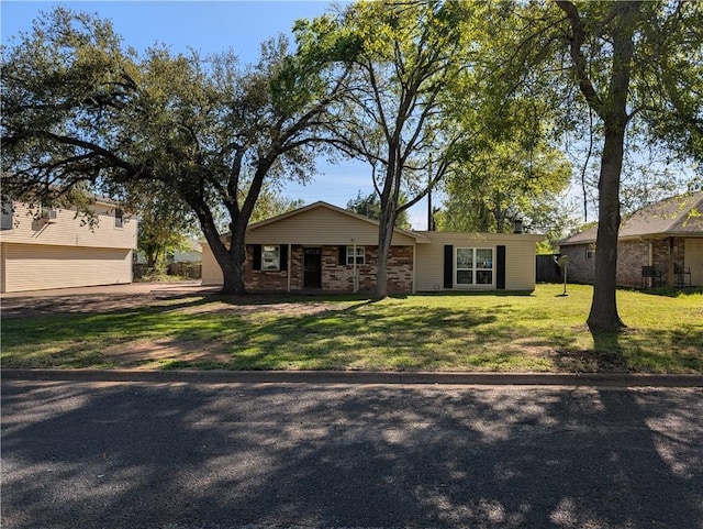 4104 Marsh St, Bryan, TX 77803 - view of front of property featuring a garage and a front yard