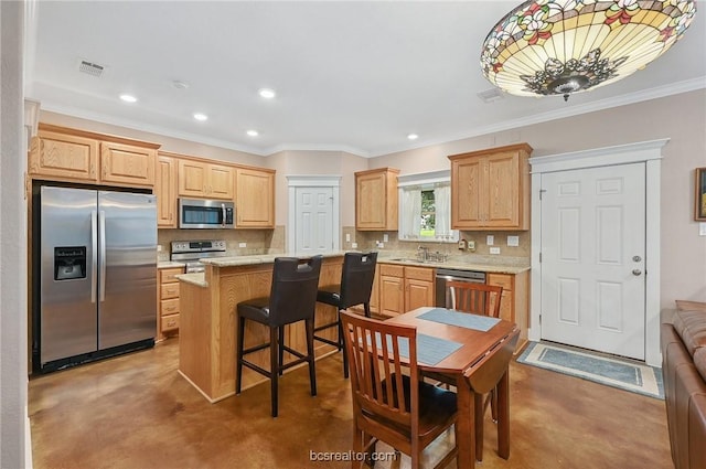 kitchen featuring sink, stainless steel appliances, tasteful backsplash, concrete flooring, and a kitchen island