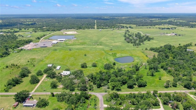 drone / aerial view featuring a rural view and a water view