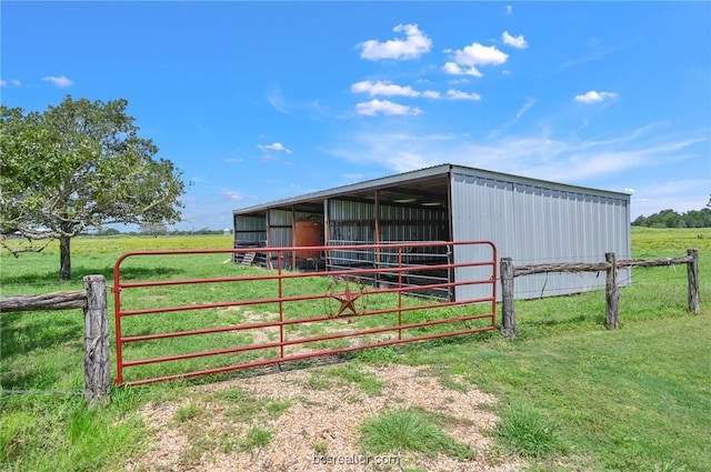 view of stable featuring a rural view