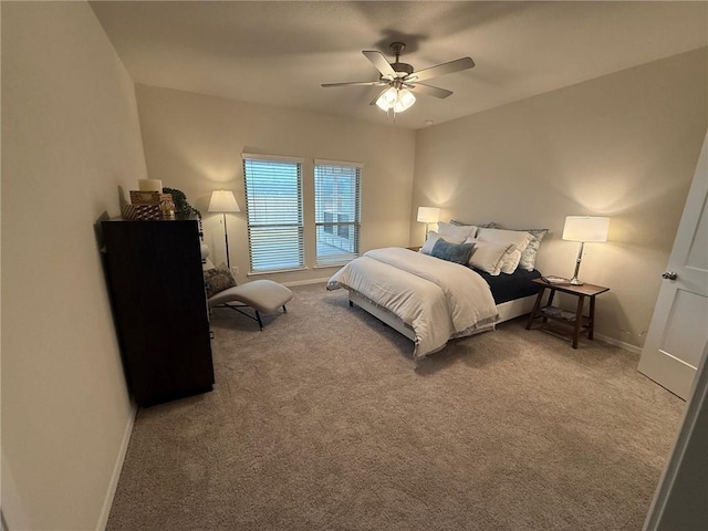 bedroom featuring ceiling fan and carpet