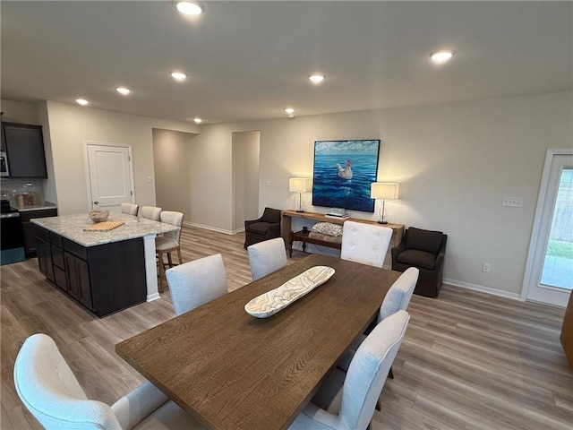 dining area with light wood-type flooring