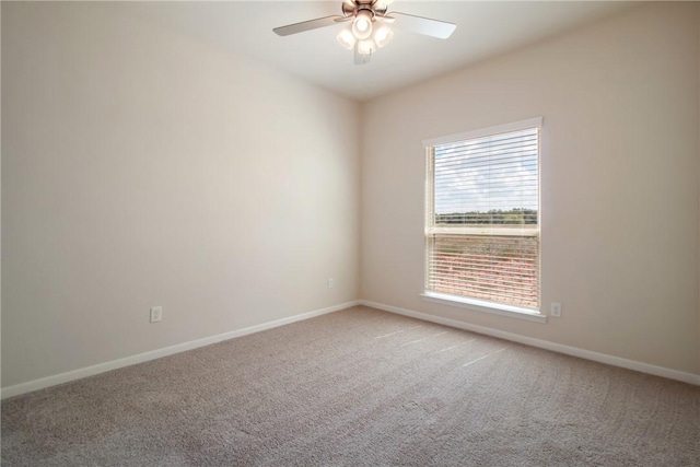 empty room with ceiling fan and carpet