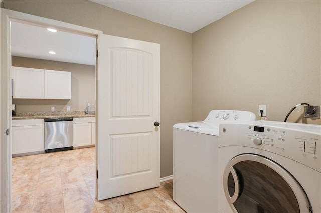 laundry room featuring sink and washing machine and clothes dryer